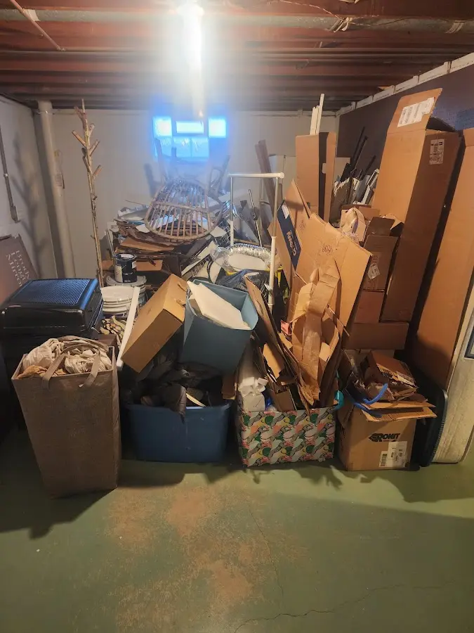 Roll-off dumpster container at job site for Yard Waste Dumpster Rental in Livermore Falls